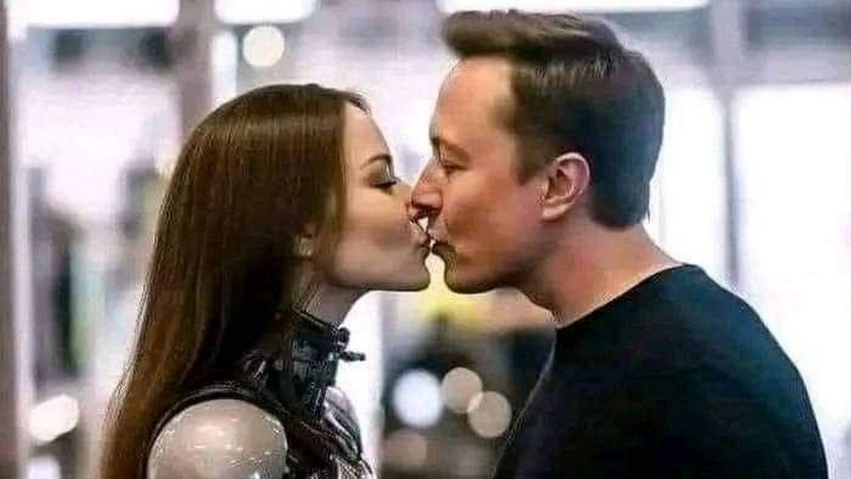 Il bacio di Elon Musk a un robot, la storia dietro gli scatti