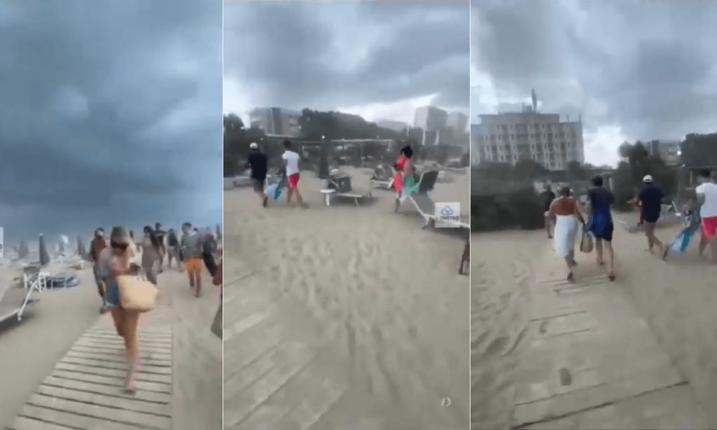 Lasciate la spiaggia il prima possibile (VIDEO) raffiche di vento e bombe d'acqua, bagnanti in fuga